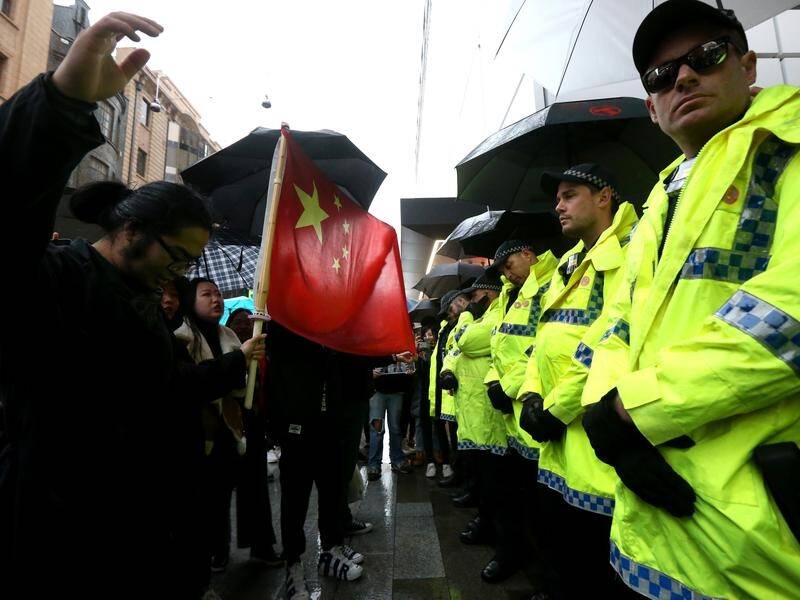Scuffles between pro-democracy and pro-China groups have broken out at rallies in Australia.
