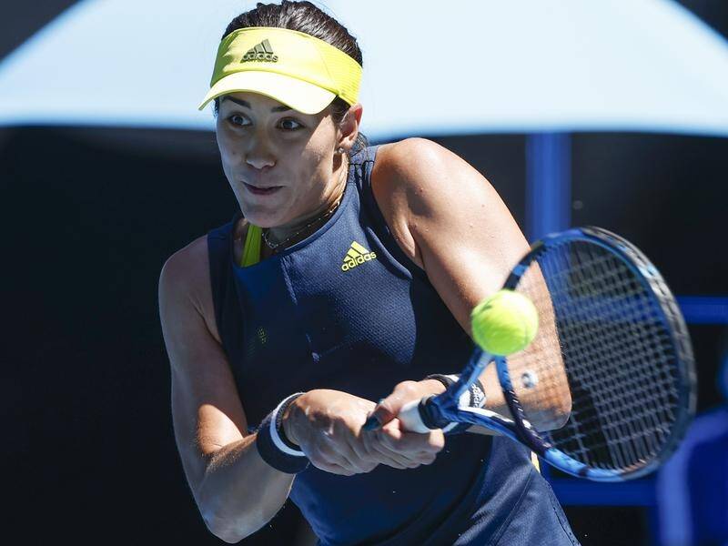 Last year's runner-up Garbine Muguruza is through to the Australian Open second round.