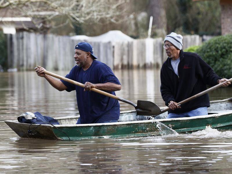 Residents of Jackson, Mississippi have been rowing around their homes to inspect damage.