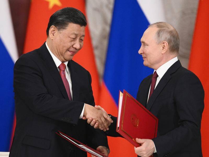 Xi Jinping and Vladimir Putin signed a series of documents on a "strategic co-operation". (AP PHOTO)