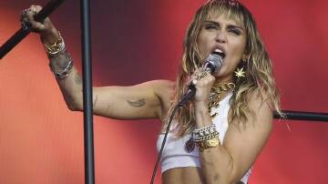 Miley Cyrus's Slide Away was found to have simpler and repetitive words compared with earlier songs. (AP PHOTO)