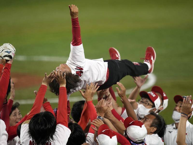 Japan celebrated their Olympic softball gold medal by tossing coach Reika Utsugi in the air.