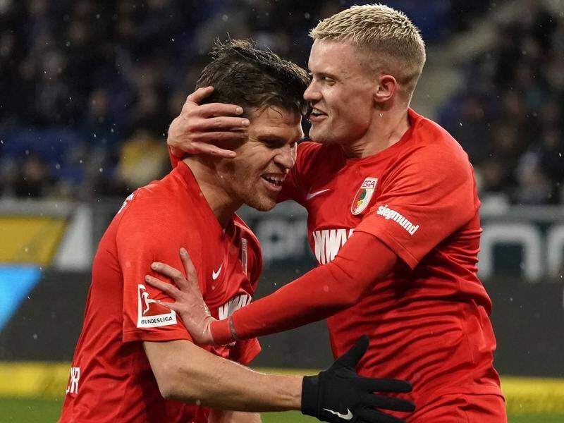 Augsburg 's Philipp Max (right) celebrates with Florian Niederlechner after scoring at Hoffenheim.