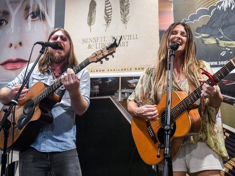 Brooke McClymont (R) with husband Adam Eckersley performing at the Tamworth Country Music Festival