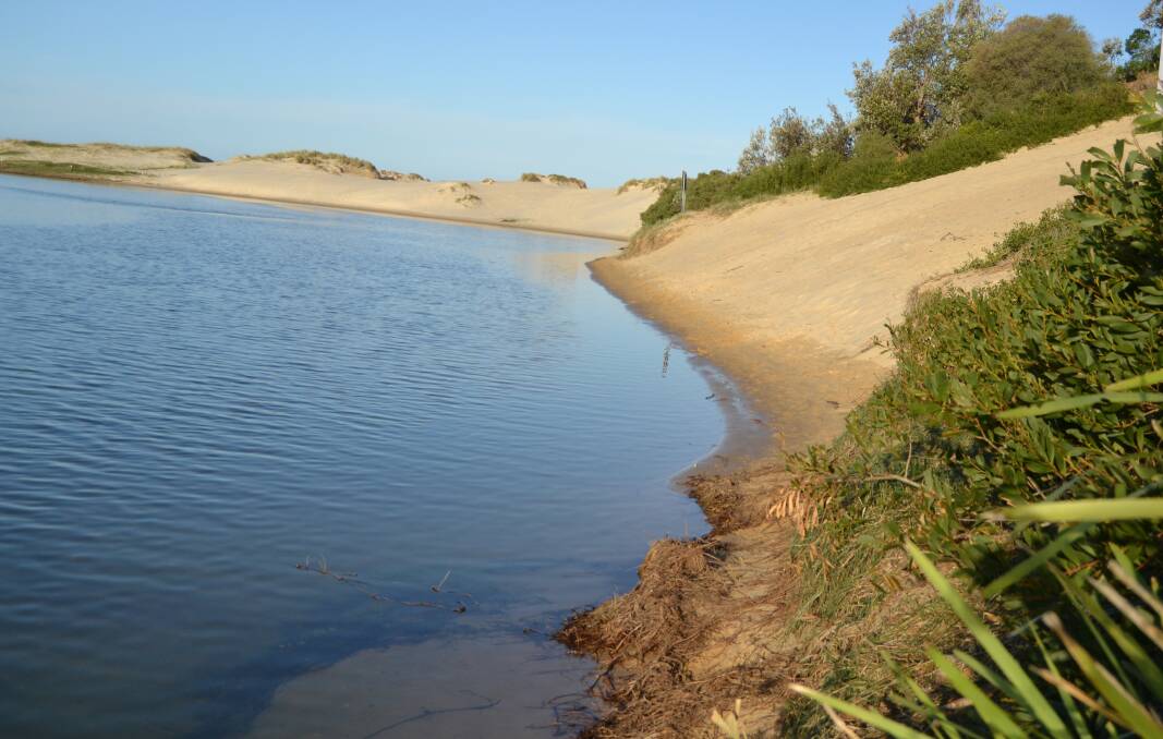 REPAIRS: A large hole and eroded sand dunes on the southern side of the Lake Conjola entrance will be filled and rehabilitated using sand dredged from further up the lake.