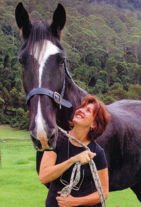 SAD LOSS: Australia’s tallest horse Archie and his owner Helene Scarf.
