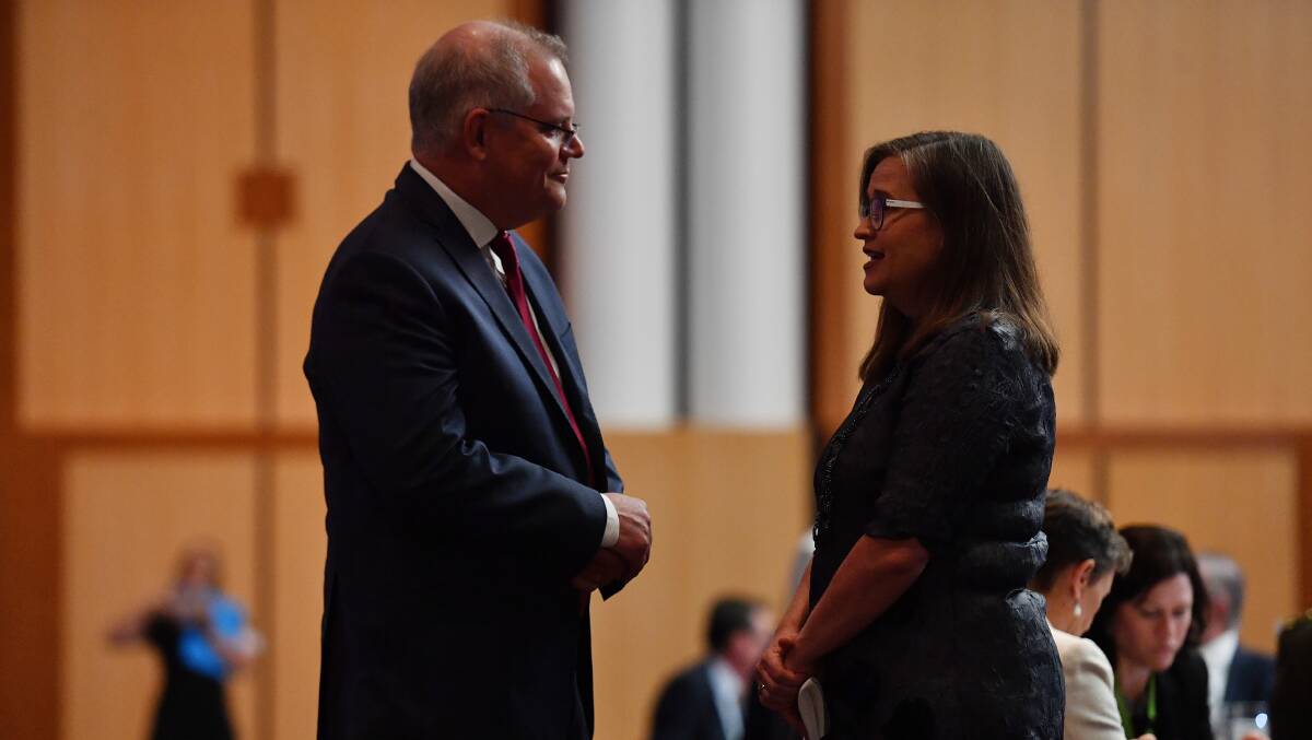 Prime Minister Scott Morrison (left) speaks with Sex Discrimination Commissioner Kate Jenkins during the International Women's Day Parliamentary Breakfast in the Great Hall at Parliament House on Thursday. Picture: Getty Images