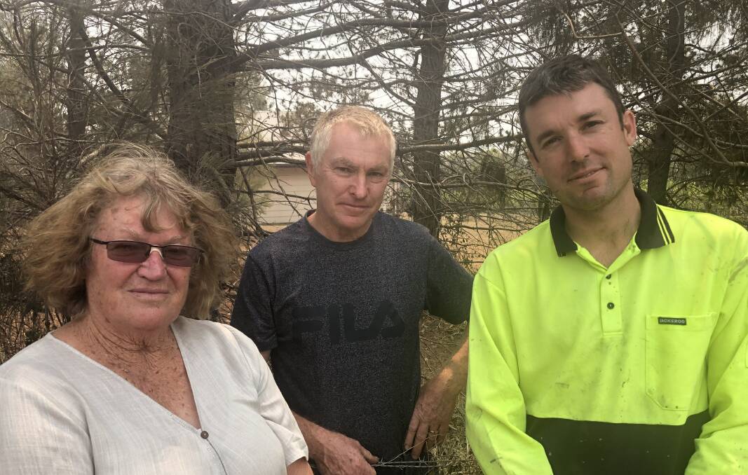 Rallying together: Nowra Hill neighbours Gail Rooney, Mark Reminis and Jeremy English describe the horror they faced on Tuesday as the winds changed and the firefront got closer.