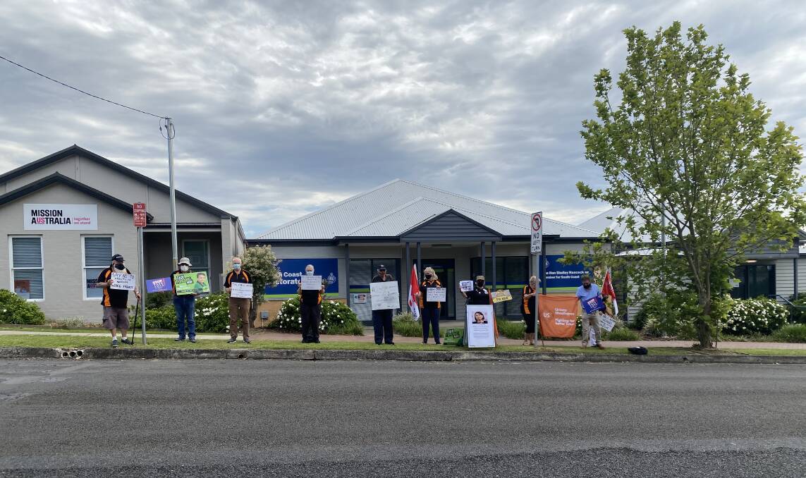 Standing up: Around a dozen union representatives protested outside of South Coast MP Shelley Hancock's office on Monday.