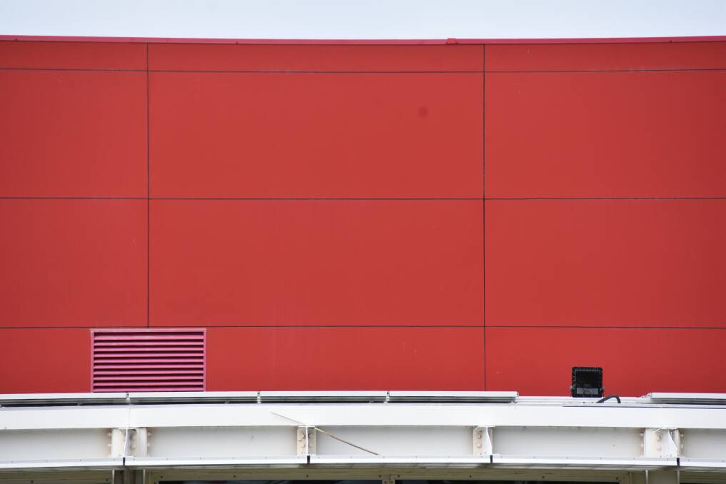 Red: A close-up of the combustible Alucobond cladding on the Shoalhaven Entertainment Centre. 