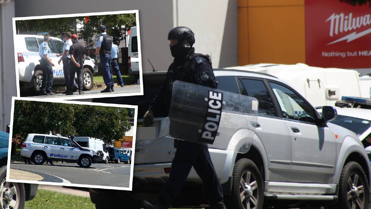 Police and tactical response officers during a standoff with a man allegedly armed with a knife in Kinghorne Street, Nowra on Thursday, February 1. Pictures by Glenn Ellard