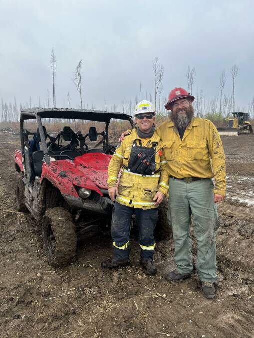 Firefighter Andrew Sweeney and an American Division supervisor in Alberta, Canada. Picture supplied