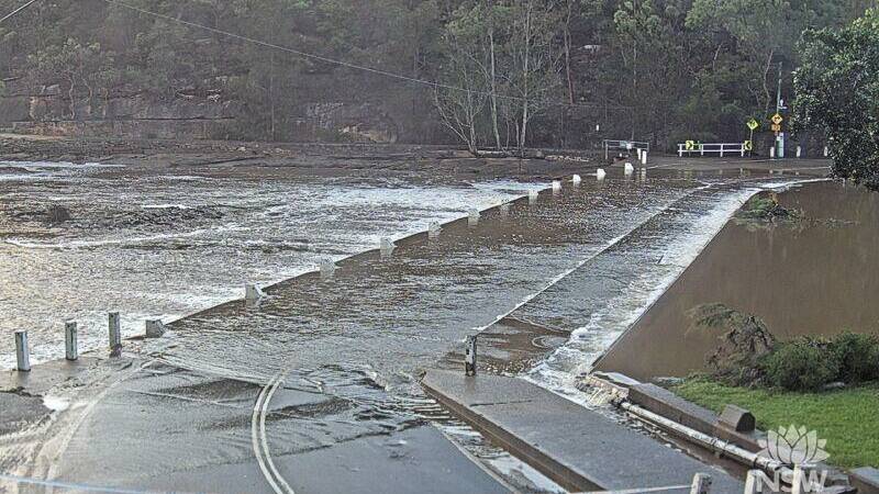 Audley Road, at Audley Weir, in the Royal National Park is among the roads closed due to floodwaters. Picture by Live Traffic
