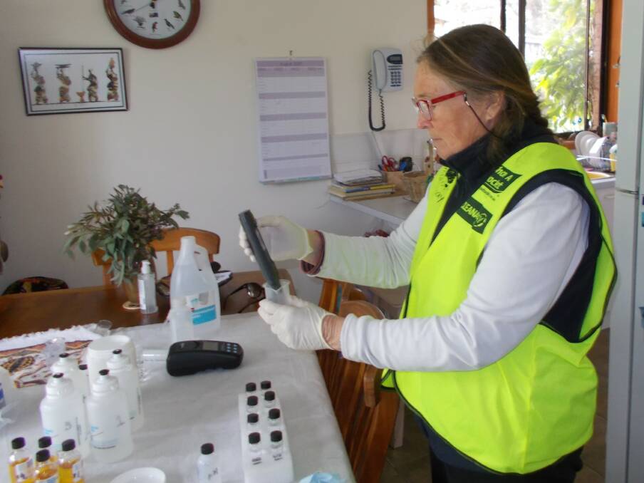 A volunteer tests some samples.