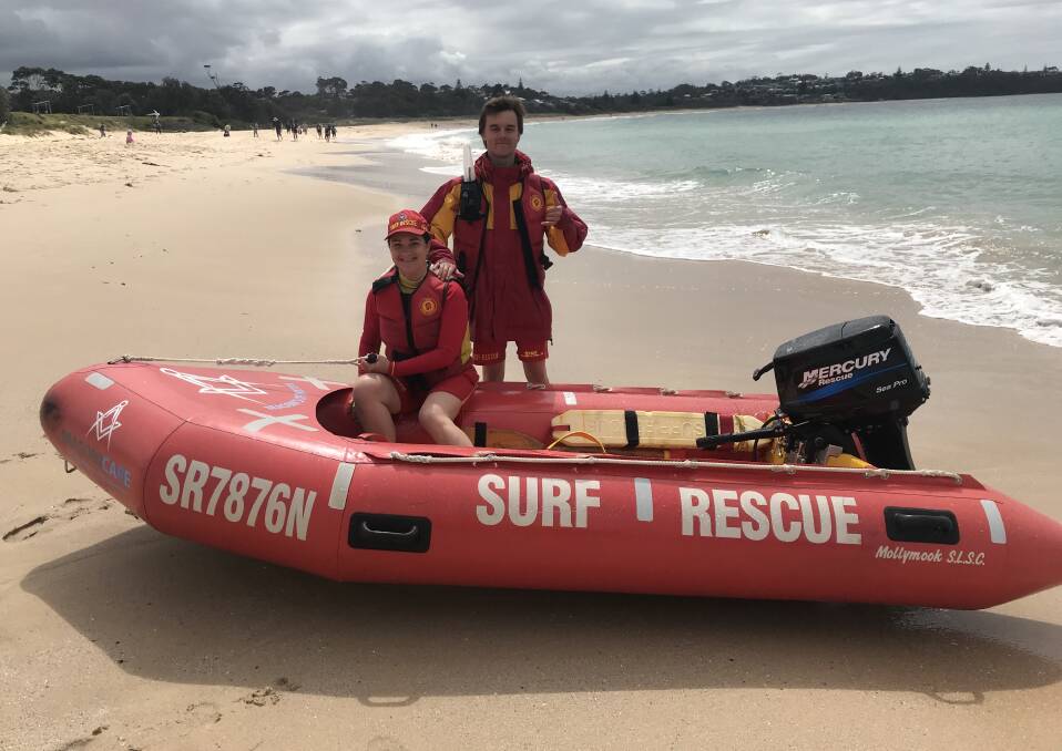 IRB driver Patrick Armstrong with crew member Kim D'Ombrainon a lookout for swimmers along the full length of Mollymook Beach during the busy holiday period.