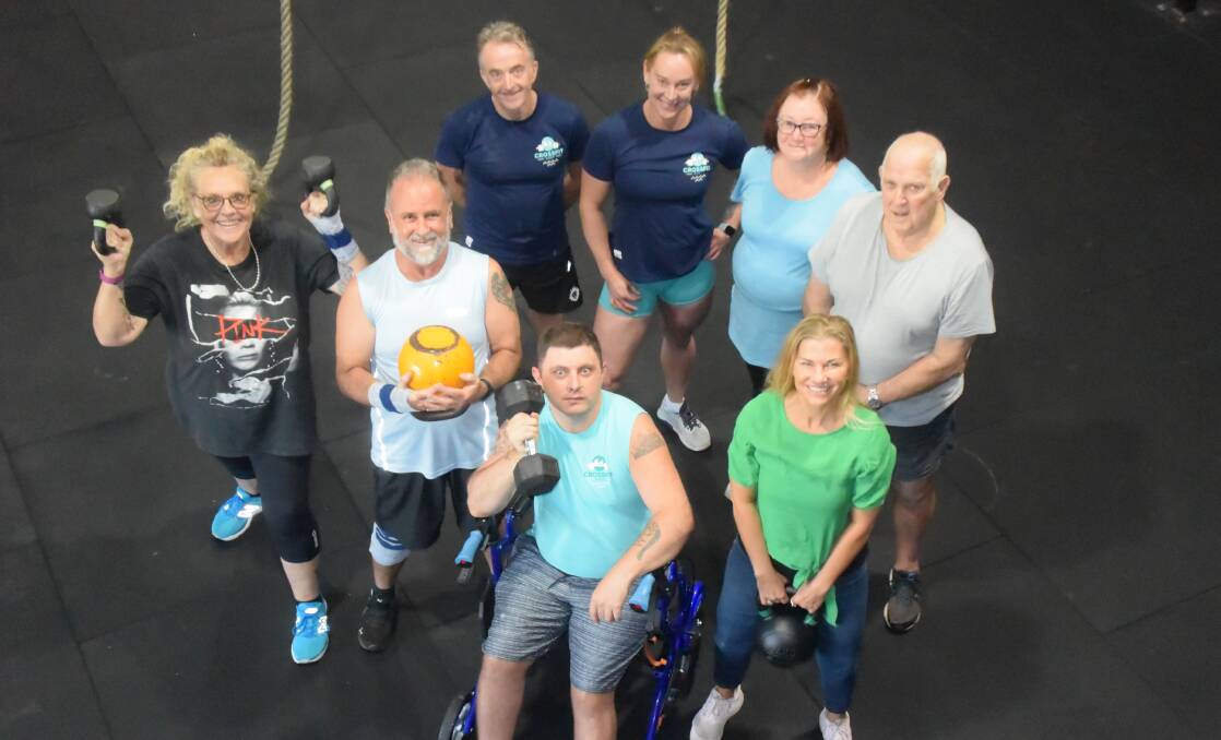 FAMILY: CrossFit Huey members Julz, Ian, Holly, Kin Richard and Harley will be cheering Roy Willis and Melissa Van Antwerpen on during Saturday's Masters HQ NSW semi-final. 