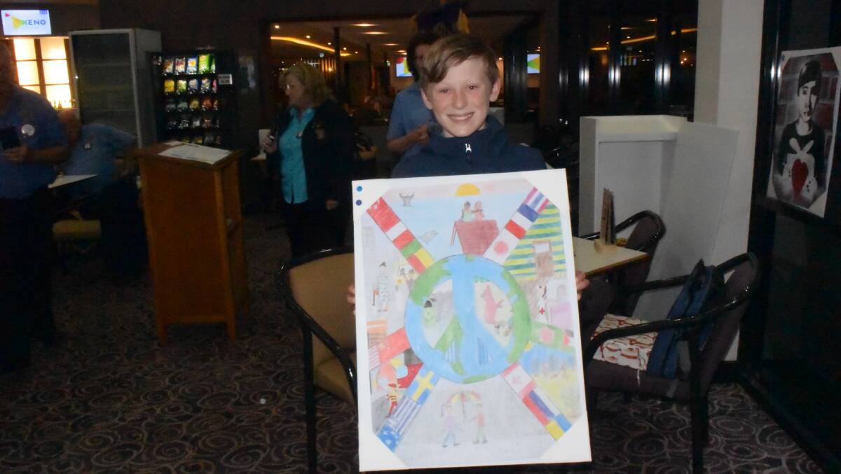 St Mary's Star of the Sea's Brigum Daly with his peace poster.