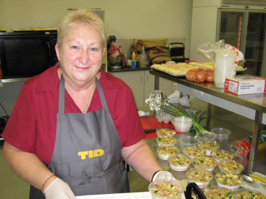 Lynda prepares some tasty food for the students to enjoy.