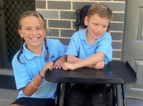 Dax on his first day of Kindy, pictured with his sister Dylan in Year 2.