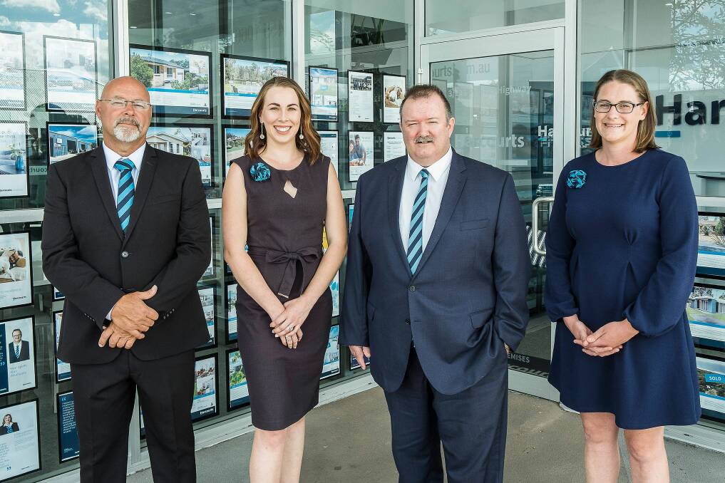 Alan Wealleans - third from left with his Harcourts Ulladulla team.