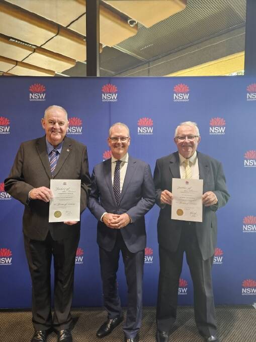 Laurence McGinty, NSW Attorney General Michael Daley and Tony Hardman at the presentation. Picture supplied 