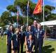 Emma and Pepper Thompson, Coralie Smith, Alex Dell, Daniel and Kate Wakeham with Tracy Dell [group leader] from the 1st Burrill-Ulladulla Sea Scout Group conducted the flag-raising ceremony.