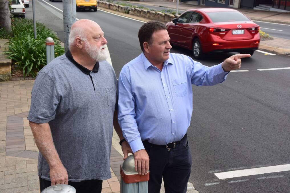  Milton Ulladulla Bypass NOW members Paul Mitchell and Grant Schultz watch as traffic in the middle of Ulladulla builds up.
