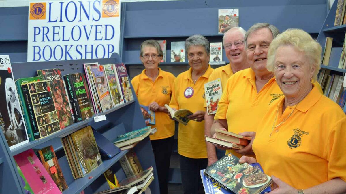 STORY TIME: Jann Wayland (front), Gerry Halliday, Colin Cameron, Gwen Rava and Jayne Langdon packing the shelves at the Ulladulla-Milton Lions Pre-loved Book Shop which will open this weekend.